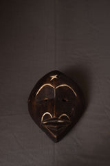 Vintage Hand-Carved Wooden Tribal Mask with Inlaid Detailing