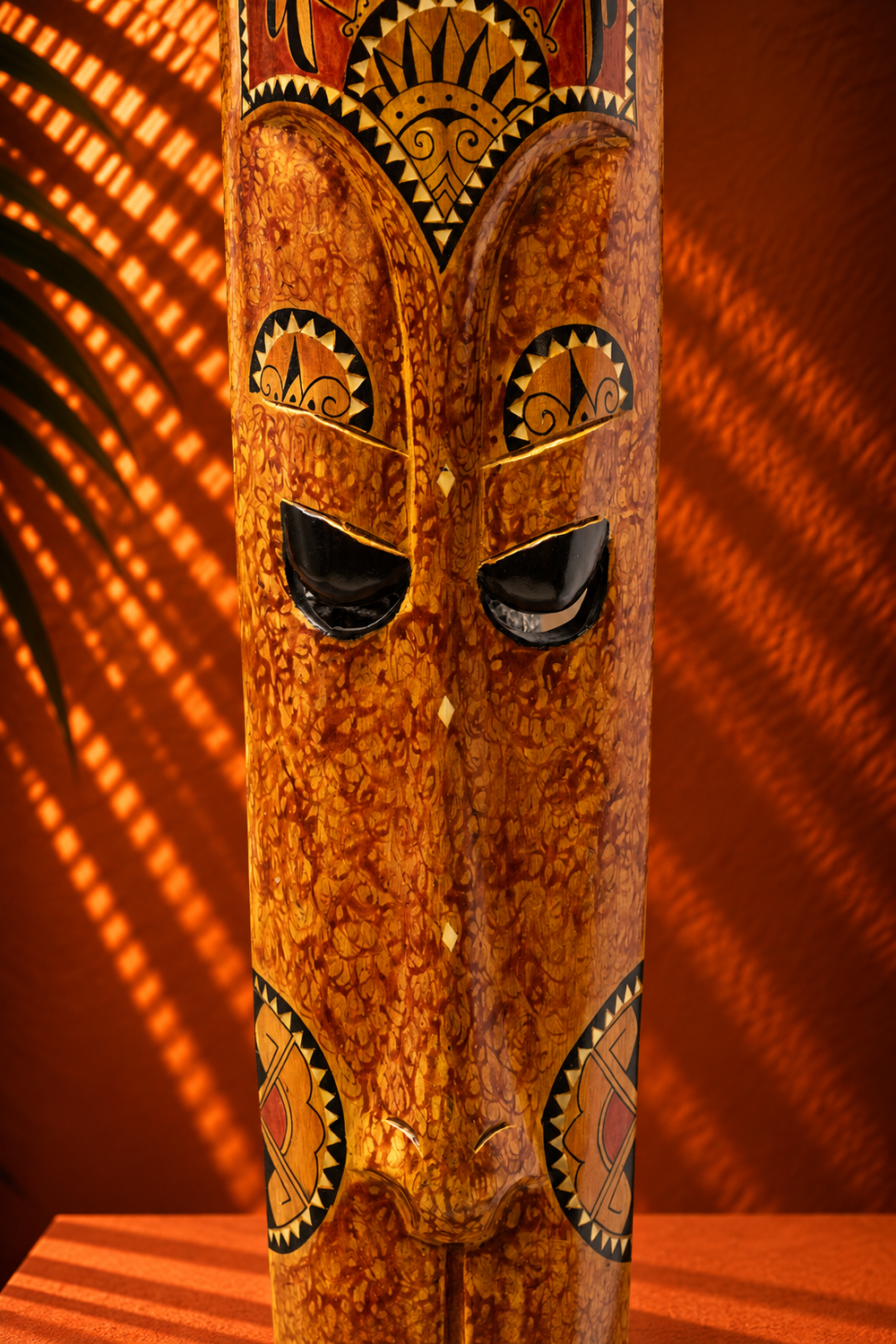 Handcrafted Wooden Tribal Mask with Intricate Traditional Carving