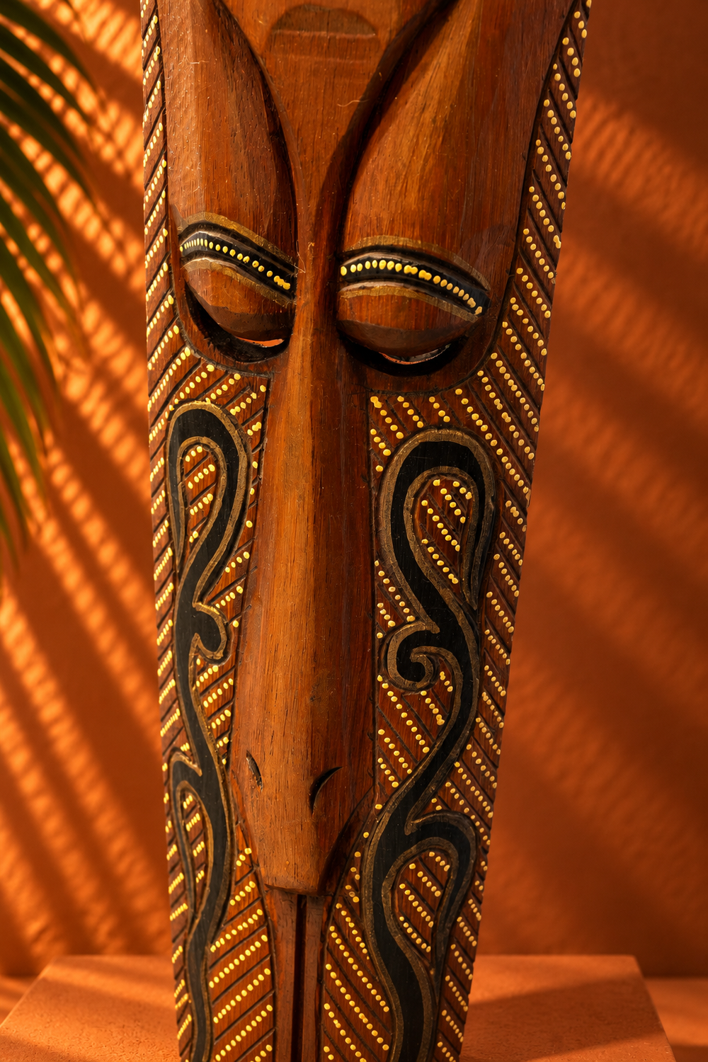 Hand-Carved Wooden Tribal Mask with Gold Detailing