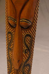 Hand-Carved Wooden Tribal Mask with Gold Detailing