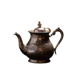 Antique Engraved Metal Teapot with Ornate Handle and Decorative Lid
