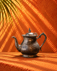 Antique Engraved Metal Teapot with Ornate Handle and Decorative Lid