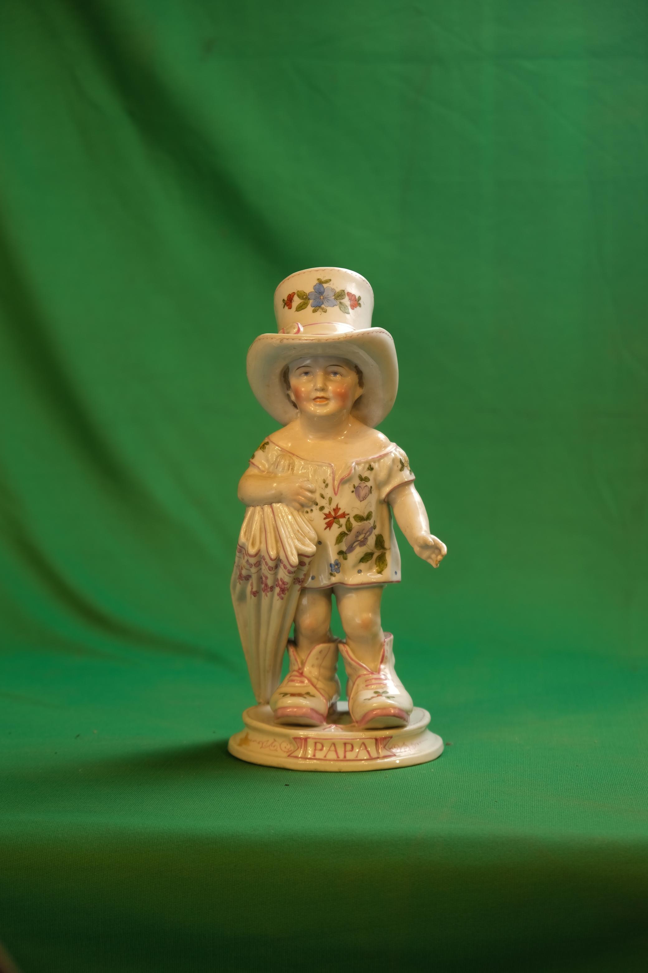 Gebrüder Heubach Porcelain "Papa's Boots" Figurine