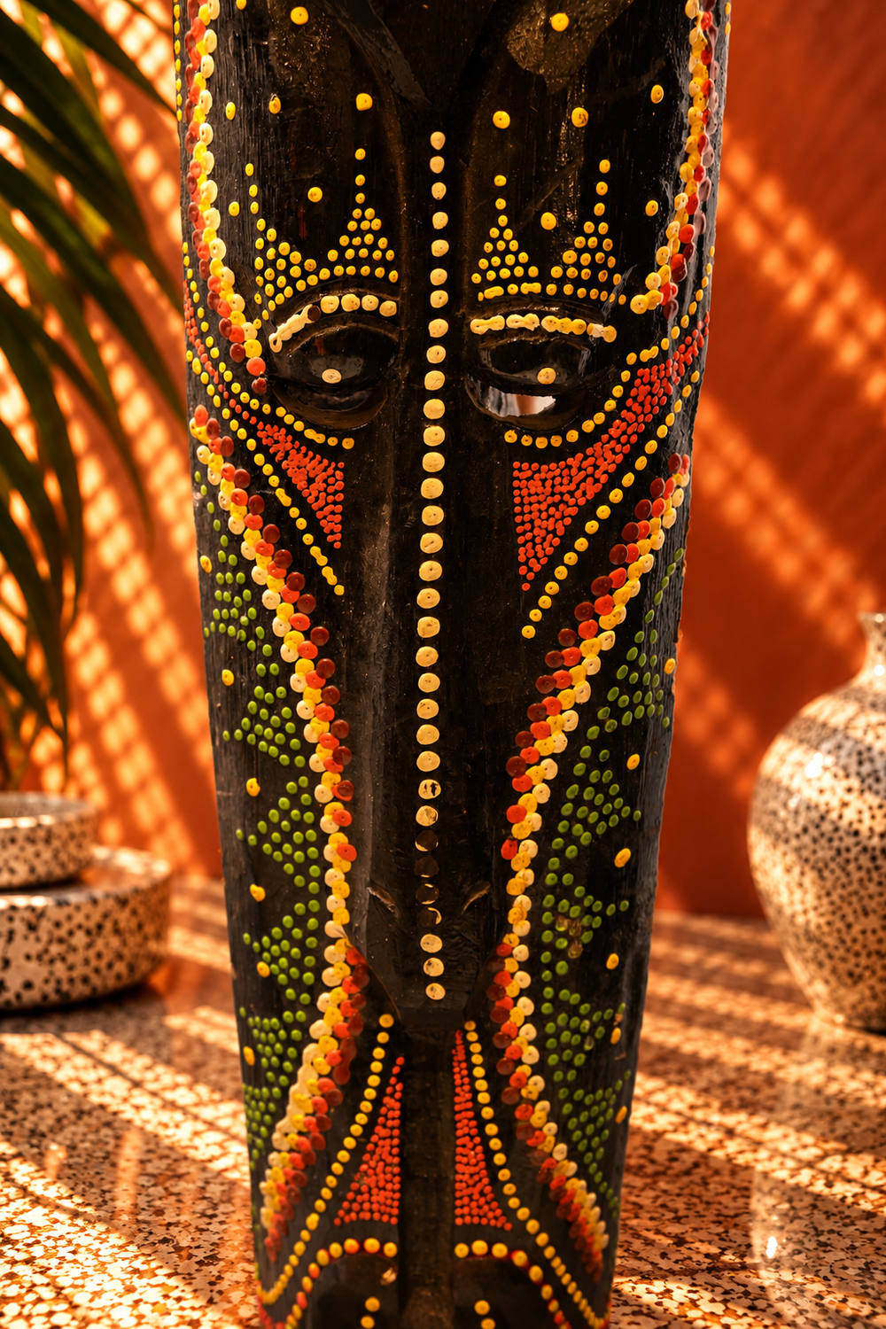Hand-Carved African Wooden Mask with Vibrant Dot-Painted Motifs