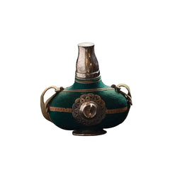 Antique Green Decorative Vessel with Ornate Metal Medallion and Traditional Straps